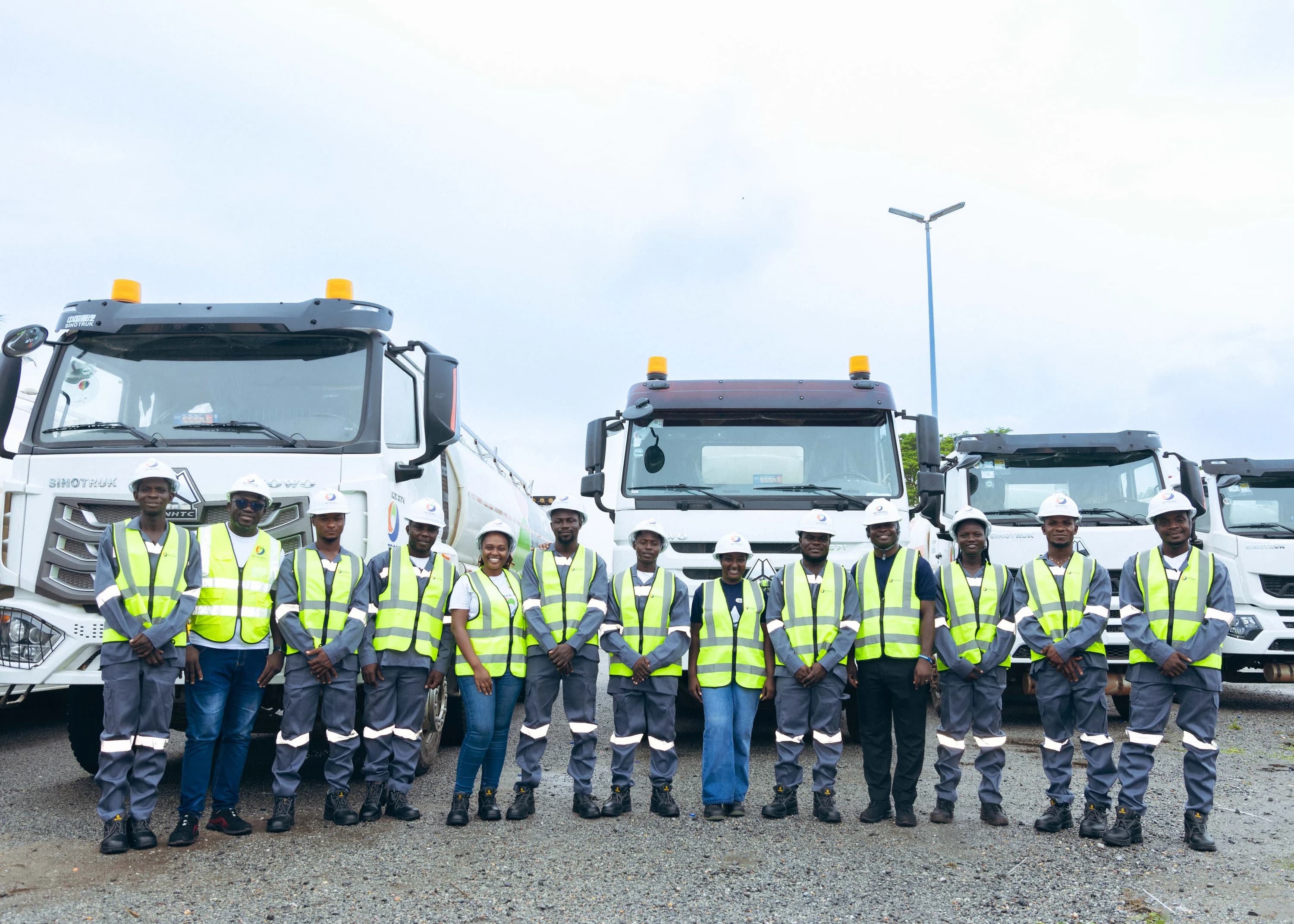 PETROSOL fleet and operations team in high-visibility vests lined up in front of tanker trucks